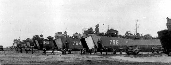 LST 794, LST 796, LST 843, LST 1030 on the beach at Okinawa